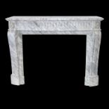 A carved Louis XVI style chimney piece in Arabascato marble with breakfront mantel,