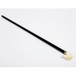An ebonised walking stick,