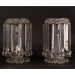 A pair of cut glass lustres hung with prismatic drops,