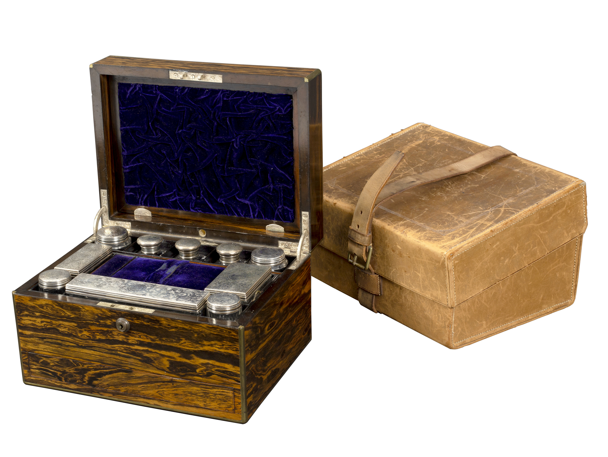 A Victorian calamander dressing case, fitted with silver topped scent bottles and jars,