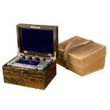 A Victorian calamander dressing case, fitted with silver topped scent bottles and jars,
