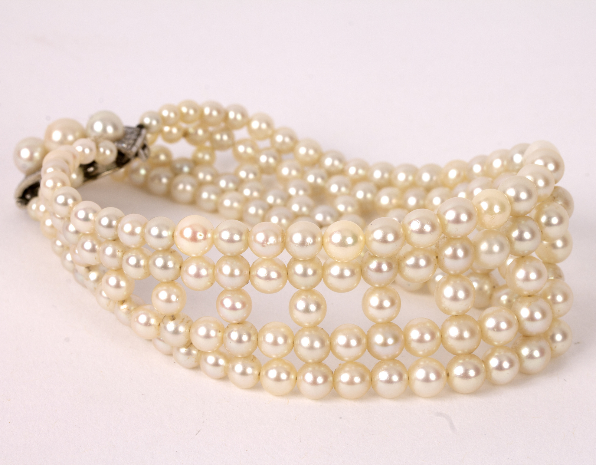 A four-row pearl bracelet with pearl and diamond clasp, 19. - Image 2 of 2