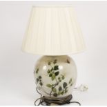 A floral pottery table light with shade