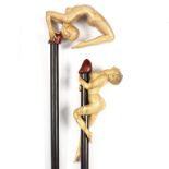 Ian Norbury (British, born 1948), two carved walking sticks of erotic design,