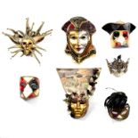 Seven Venetian papier-mâché ball masks, various designs/Provenance: Eastington Hall,