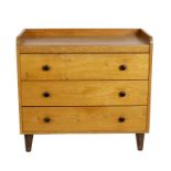 Gordon Russell, a mid 20th Century light oak chest of drawers, with three-quarter galleried top,