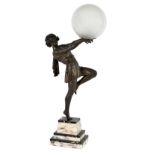 An Art Deco style lamp in the form of a metal figure of a dancer,