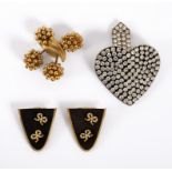 Emporio Armani, a large metallic heart brooch studded with white stones,