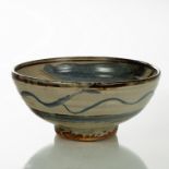 Michael Cardew (British 1901-1983), a stoneware bowl raised on a circular foot,