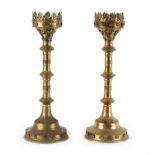 A pair of Gothic Revival brass candlesticks, 49.