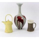 Bridget Drakeford (British, born 1946), a celadon glazed vase with red drip body,