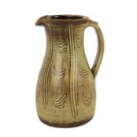 Ray Finch for Winchcombe Pottery, a stoneware jug, the caramel glaze with combed design, 25.