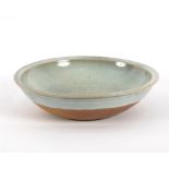 Ray Finch for Winchcombe Pottery, a circular shallow bowl with speckled celadon glaze,