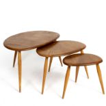 Ercol, a nest of three beech Pebble tables,