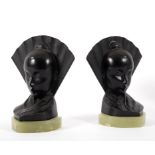 A pair of onyx and black metal bookends in the form of an Oriental lady's head with fan behind, 17.