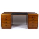 Gimson & Slater Ltd, a mid Century teak pedestal desk, each pedestal fitted four drawers,