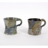 Jane Hamlyn (British, born 1940), two pottery mugs each with ropetwist handle and incised lines,