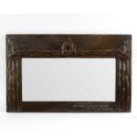 An Arts and Crafts copper wall mirror,