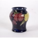 Moorcroft, a small vase painted plums, impressed marks,