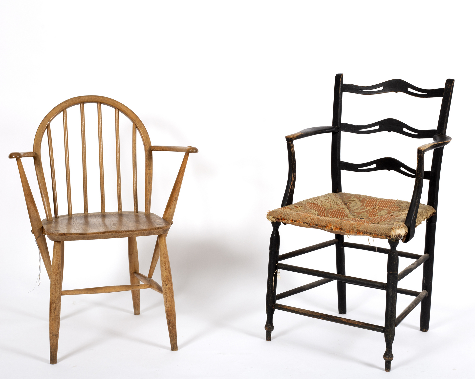 An Arts and Crafts style ebonised ladder back chair and an Ercol ash and elm Windsor chair