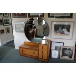 A 1950s bedroom suite in figured maple, comprising dressing table with circular mirror,