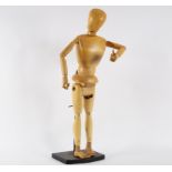A large articulated artist's mannequin, approximately 124cm high,