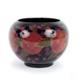 A Moorcroft pomegranate vase of globular form, marks green script and impressed,