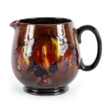 Moorcroft, a leaf and berries pattern jug, blue painted signature and stamp,