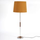 Danish mid-20th Century, a standard lamp in stainless steel and rosewood on circular foot,