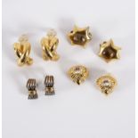 Givenchy, a pair of gold coloured ear clips of cross design,