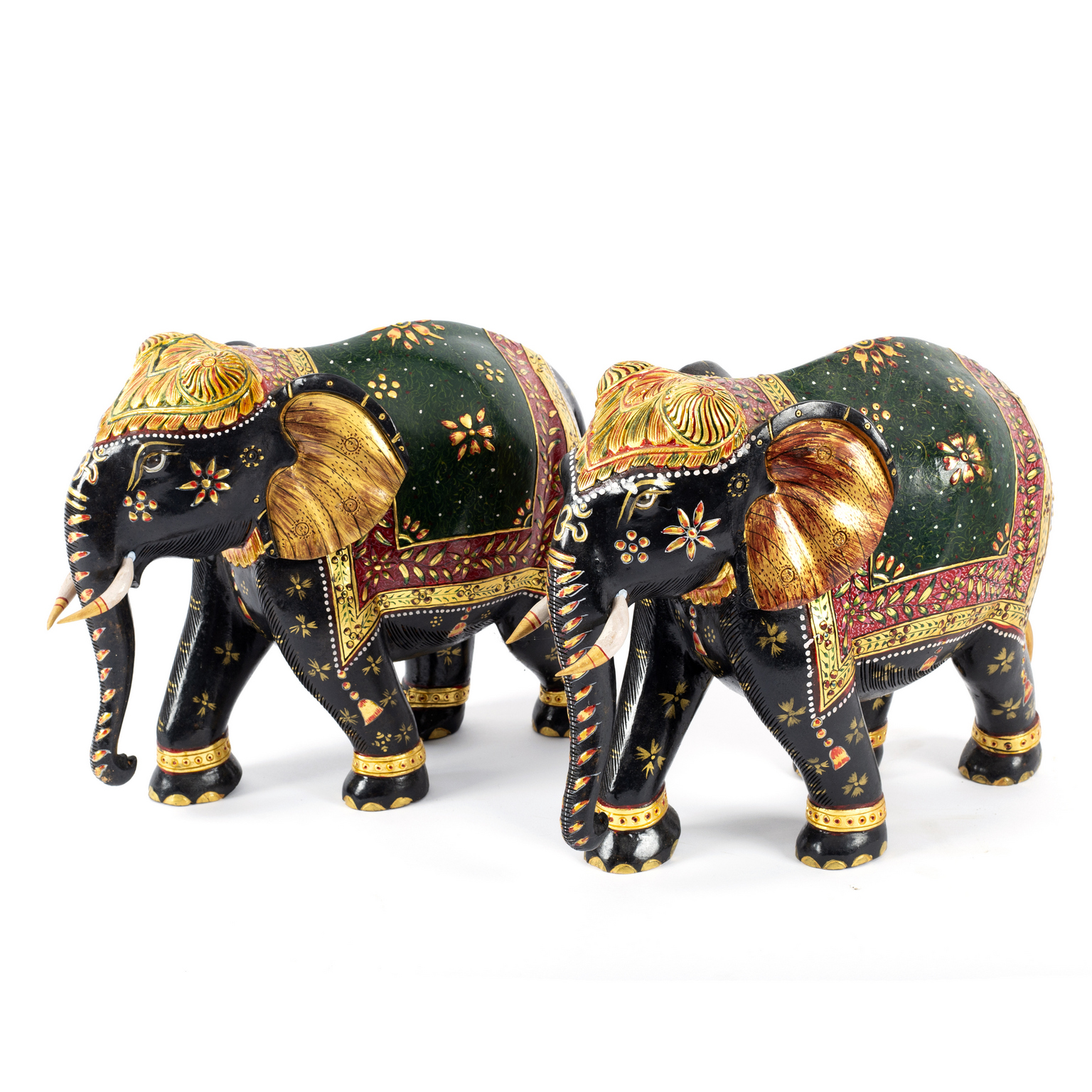 A pair of painted and gilded wood Indian elephants, 36cm long/Provenance: Eastington Hall,