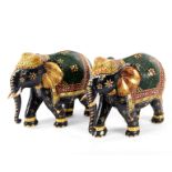 A pair of painted and gilded wood Indian elephants, 36cm long/Provenance: Eastington Hall,