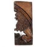 A 17th Century panel fragment carved a lion,
