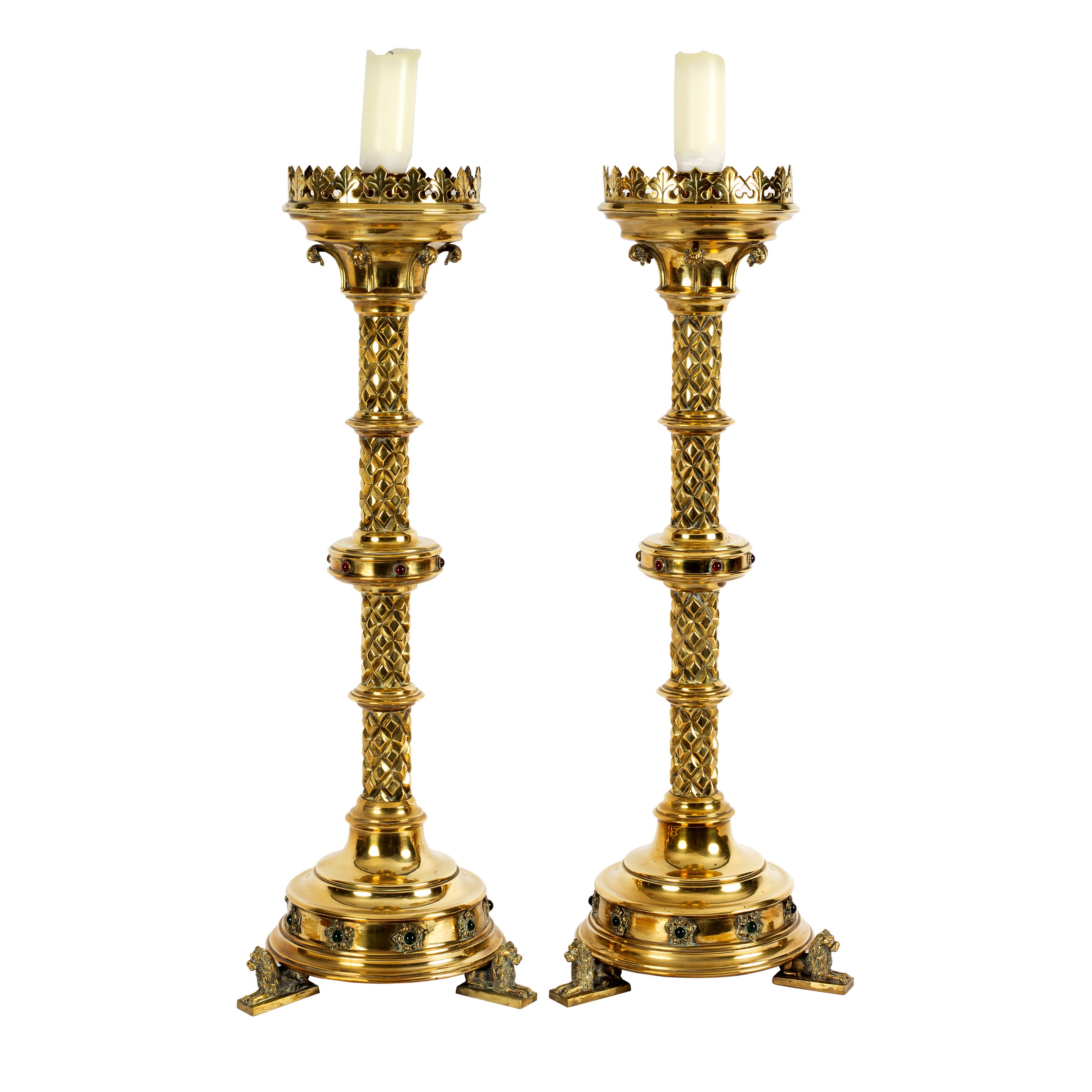 A pair of 19th Century Gothic Revival brass floor standing candlesticks,