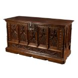 A 16th Century French oak coffer (restorations), the rectangular top with cleated border,