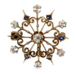 A sapphire and diamond snowflake brooch/pendant of openwork form,