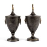 A pair of oval toleware vases and covers, 30.