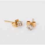 A pair of diamond ear studs, claw set to 18ct gold posts, the stones of approximately 0.