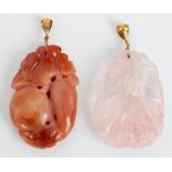 Two Chinese carved hardstone pendants, modelled as fruit, one in rose quartz,