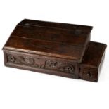 A carved oak bible box initialled and dated 1616,