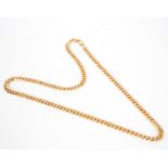 A 9ct yellow gold necklace of flattened curb links, approximately 68.