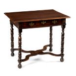 An early 18th Century oak side table the rectangular top above a plain frieze drawer,