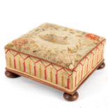 A Victorian upholstered footstool on bun feet,