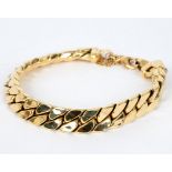 An 18ct yellow gold bracelet of flattened links, with safety chain,