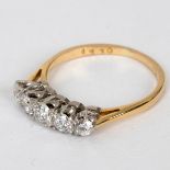 A diamond five-stone ring, the stones claw set in platinum to a yellow gold shank,