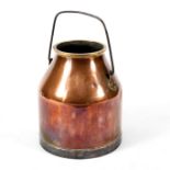 A copper milk churn,