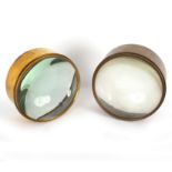 Two circular brass mounted magnifying lenses,