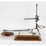 A wrought iron spit stand,