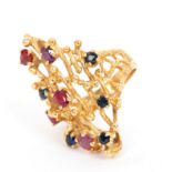 A sapphire and ruby ring in the style of Andrew Grima,