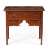 An oak kneehole desk fitted three drawers on square chamfered legs,